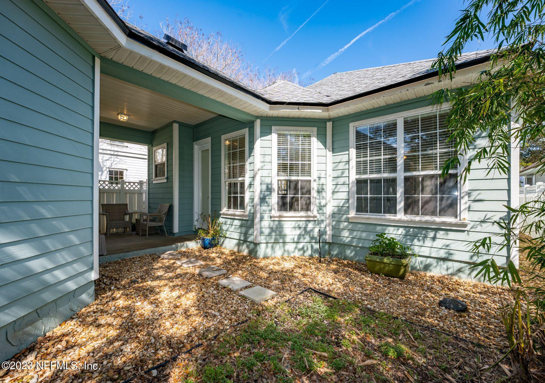 509 West Side Row St. Augustine, FL 32095 - Photo 32 of 61 Breezeway & backyard