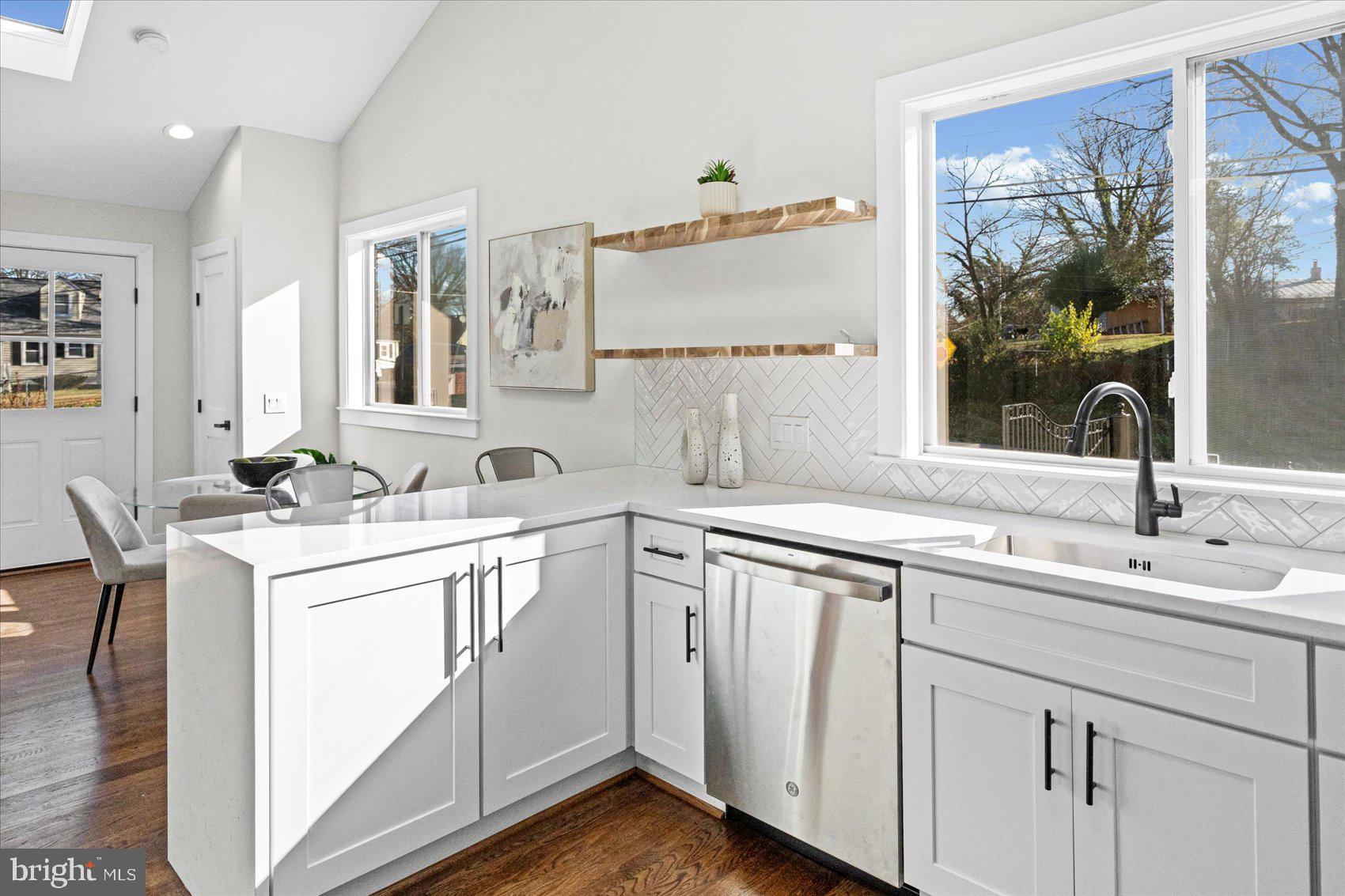 605 Elfin Avenue Capitol Heights, MD 20743 - Photo 14 of 42 a view with double vanity sink a mirror and a window