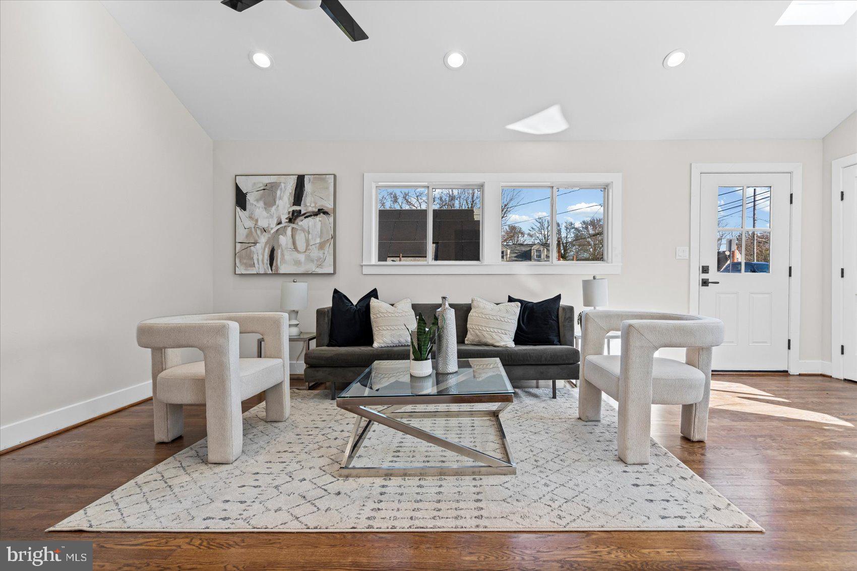 605 Elfin Avenue Capitol Heights, MD 20743 - Photo 16 of 42 a living room with furniture and a rug