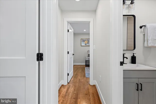 a view of a bathroom from a hallway