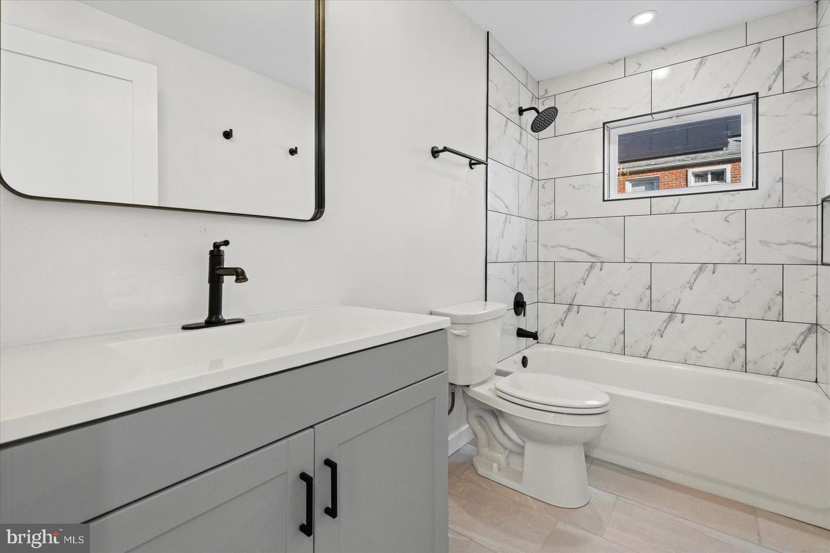 605 Elfin Avenue Capitol Heights, MD 20743 - Photo 19 of 42 a bathroom with a sink a toilet and shower