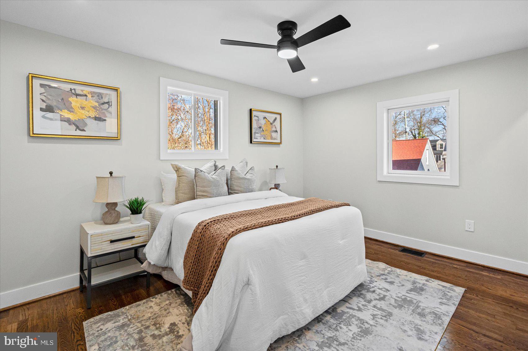 605 Elfin Avenue Capitol Heights, MD 20743 - Photo 20 of 42 a bedroom with a bed and wooden floor