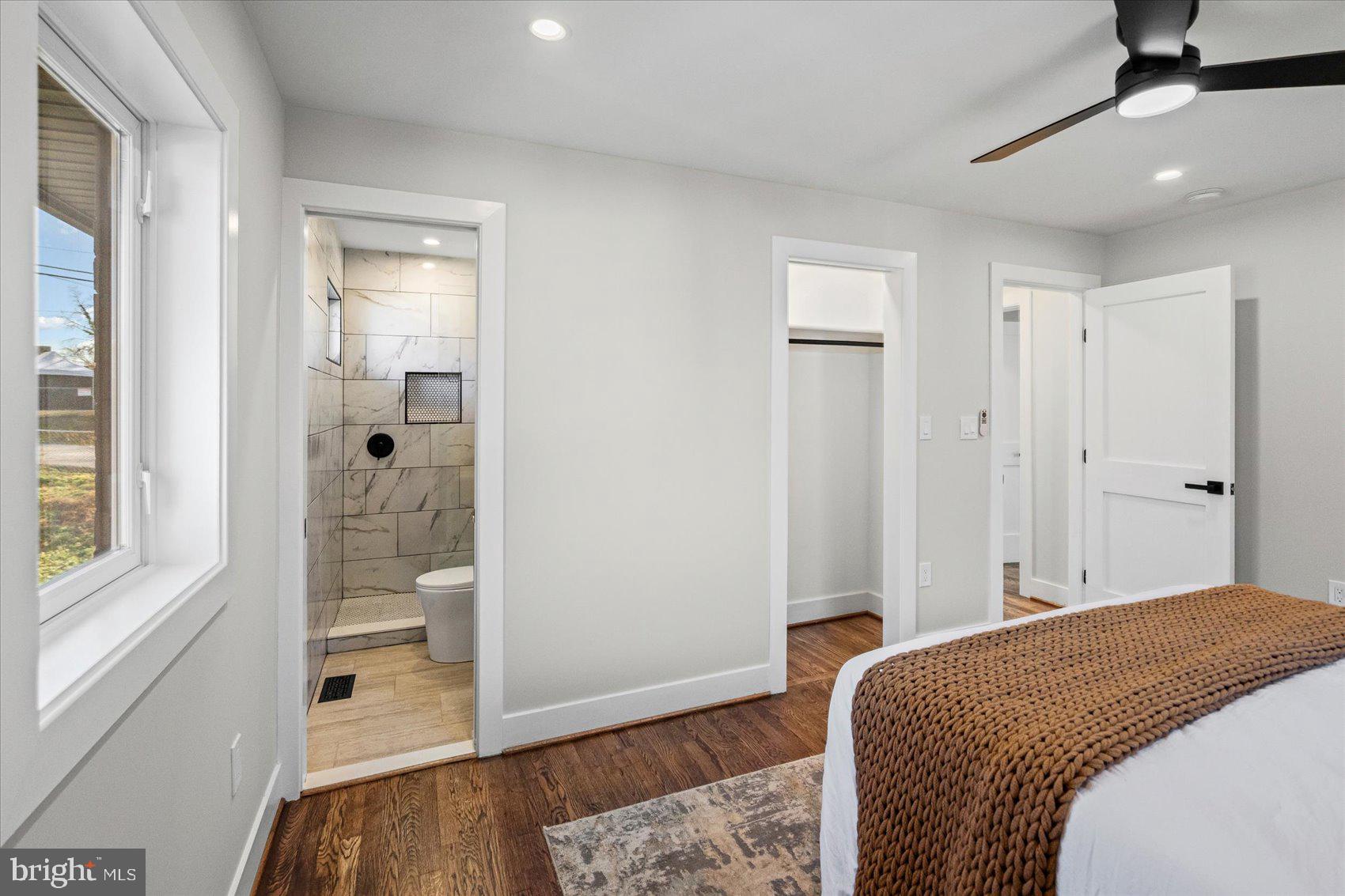 605 Elfin Avenue Capitol Heights, MD 20743 - Photo 21 of 42 a bedroom with a bed and wooden floor