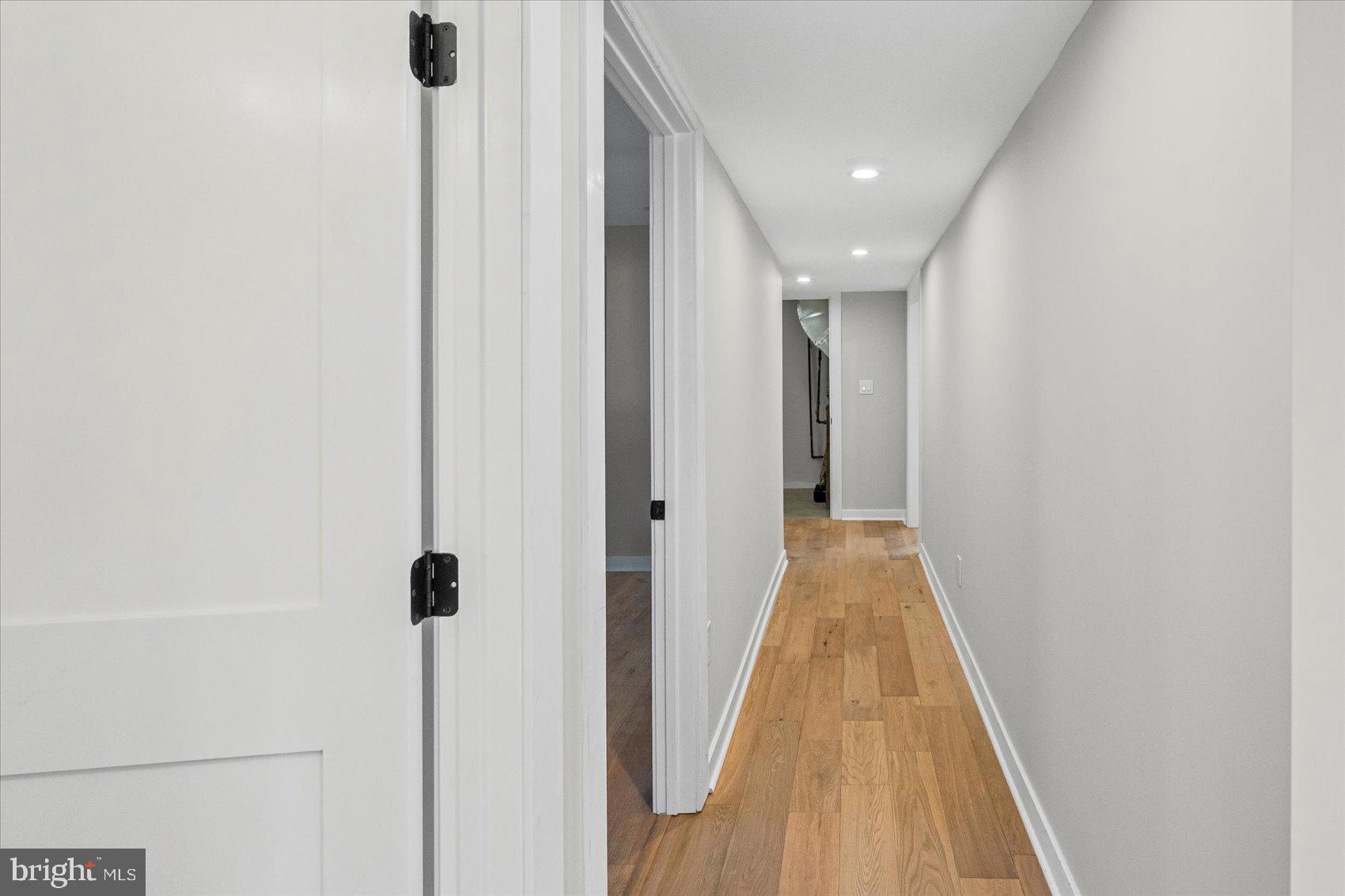 605 Elfin Avenue Capitol Heights, MD 20743 - Photo 28 of 42 a view of a hallway with wooden floor