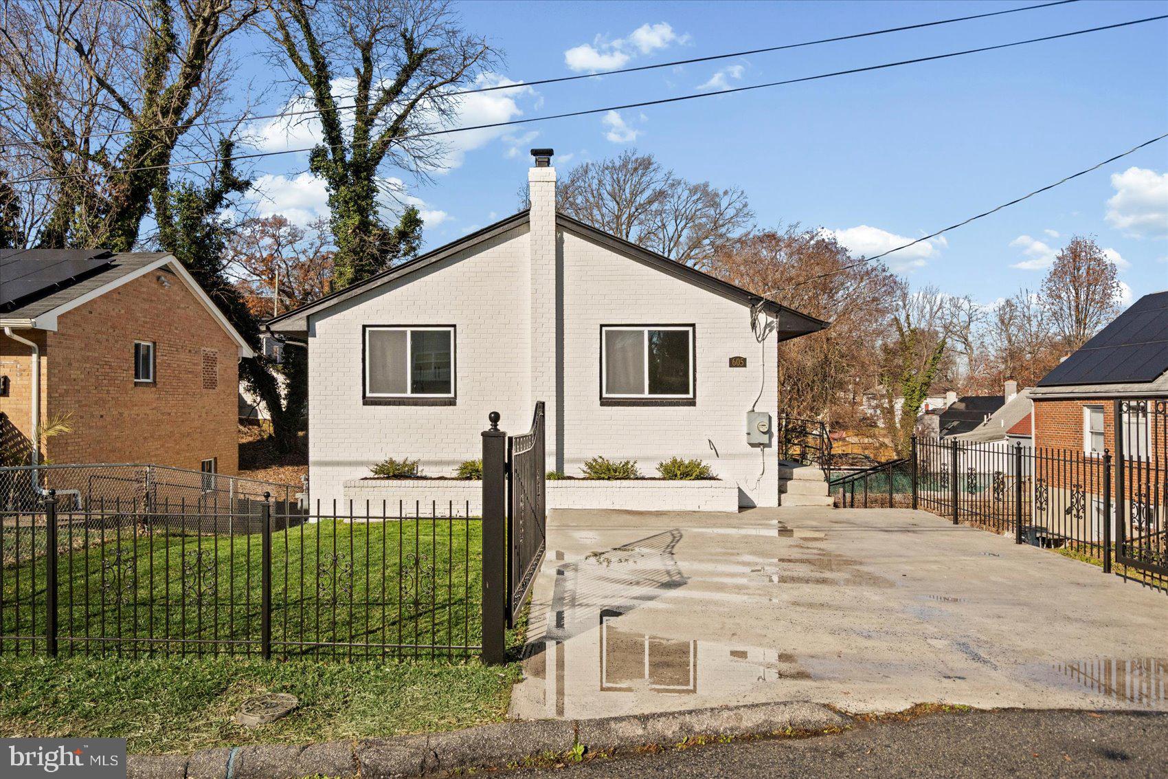 605 Elfin Avenue Capitol Heights, MD 20743 - Photo 3 of 42 a front view of a house with a yard