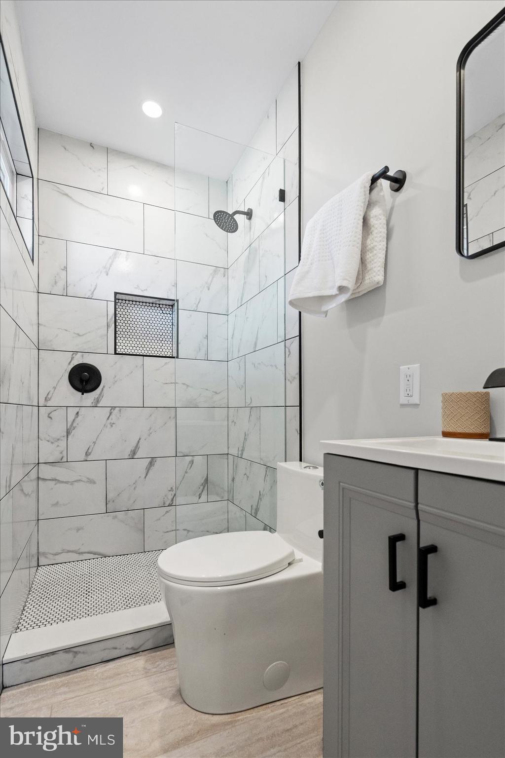 605 Elfin Avenue Capitol Heights, MD 20743 - Photo 33 of 42 a bathroom with a shower a toilet and sink