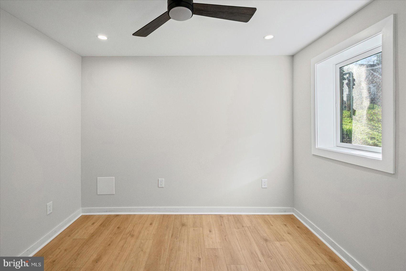 605 Elfin Avenue Capitol Heights, MD 20743 - Photo 35 of 42 wooden floor in an empty room with a window