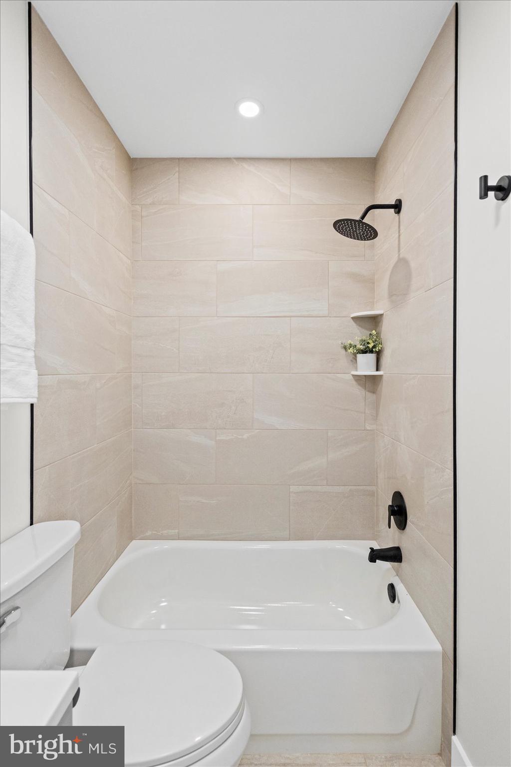 605 Elfin Avenue Capitol Heights, MD 20743 - Photo 37 of 42 a bathroom with a bathtub and a toilet