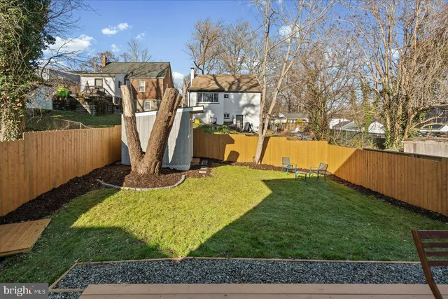 a view of a yard with swings