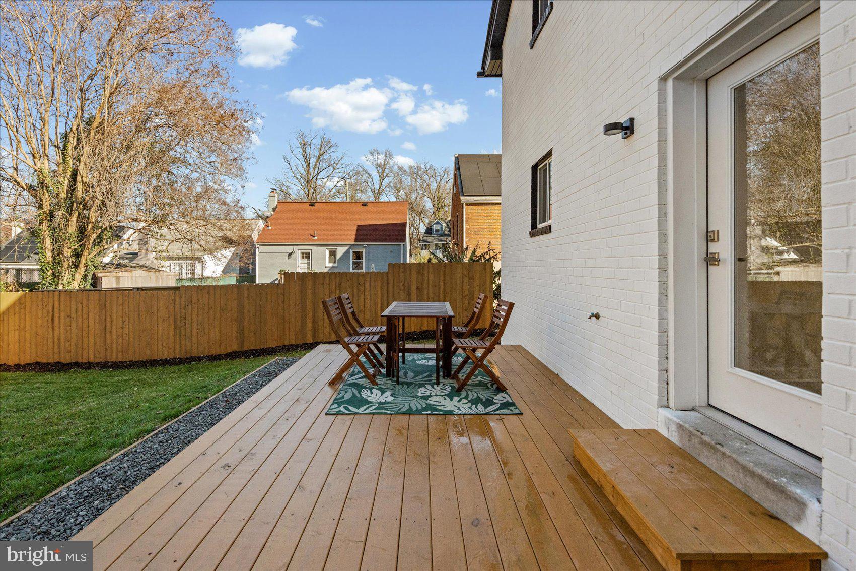 605 Elfin Avenue Capitol Heights, MD 20743 - Photo 42 of 42 a wooden bench sitting in front of a house