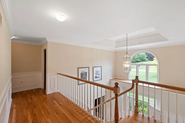 a view of a room with windows and wooden floor