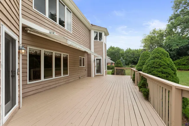 a view of a house with pool on deck