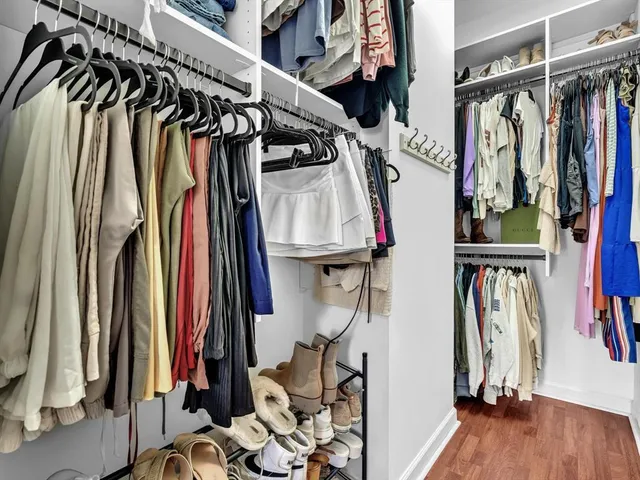 a bedroom with a bed and a flat screen television