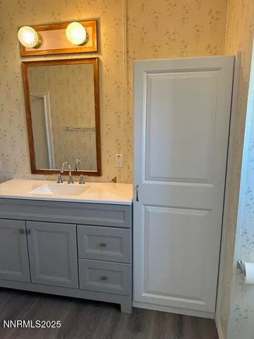 a bathroom with a toilet and a sink
