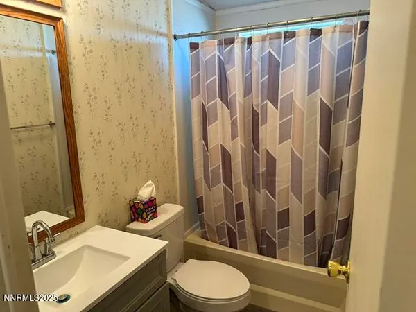 a room with a bed and window