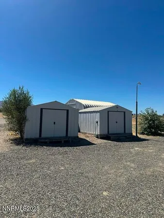 a kitchen with stainless steel appliances white cabinets and wooden floors