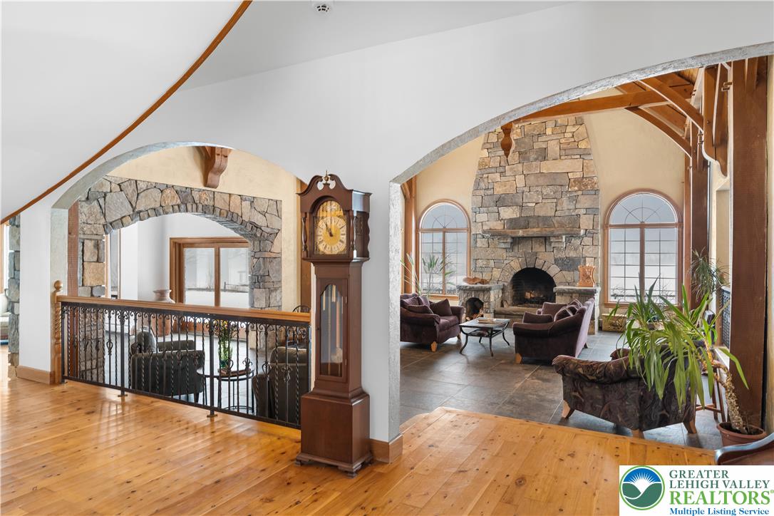 216 Merwinsburg Road Effort, PA 18330 - Photo 13 of 50 a living room with fireplace furniture or chandelier and a wooden floor