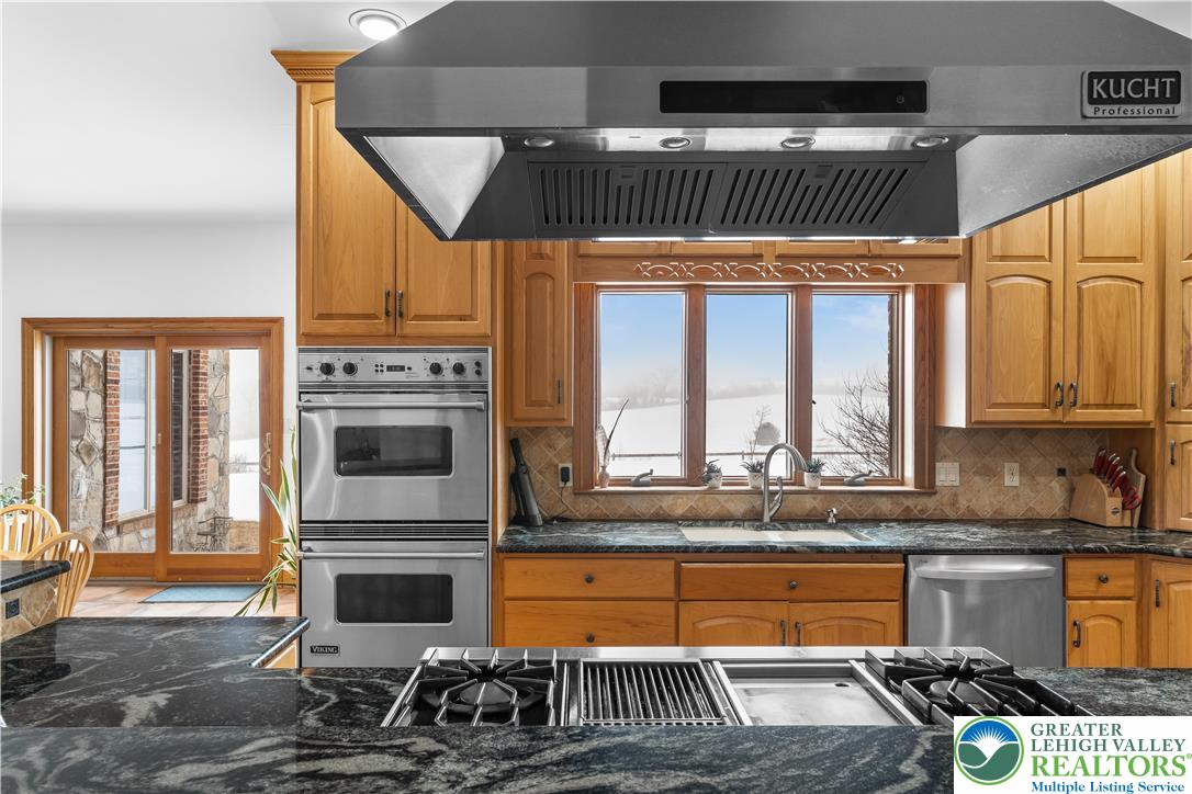 216 Merwinsburg Road Effort, PA 18330 - Photo 15 of 50 a kitchen with a refrigerator a sink and cabinets