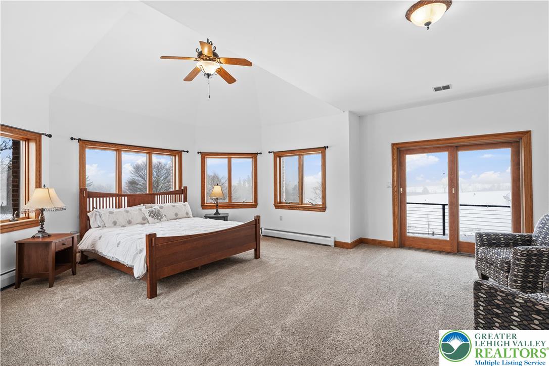 216 Merwinsburg Road Effort, PA 18330 - Photo 24 of 50 a spacious bedroom with a bed couch and a large window