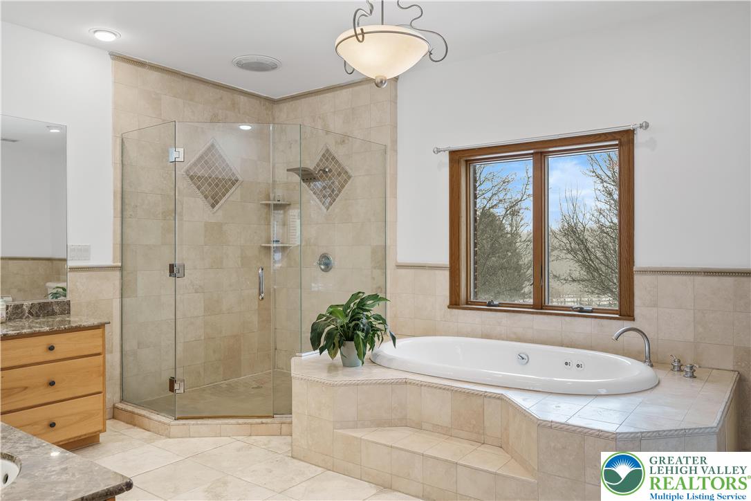 216 Merwinsburg Road Effort, PA 18330 - Photo 27 of 50 a bathroom with a tub sink and mirror