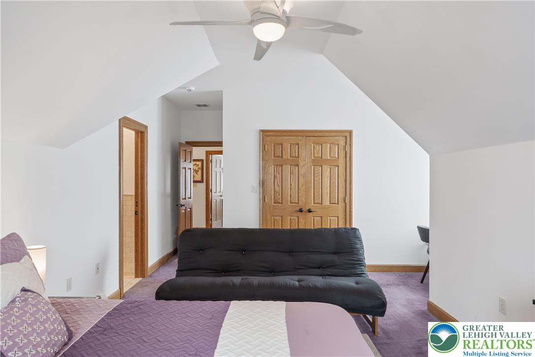 216 Merwinsburg Road Effort, PA 18330 - Photo 31 of 50 a living room with a couch and a potted plant