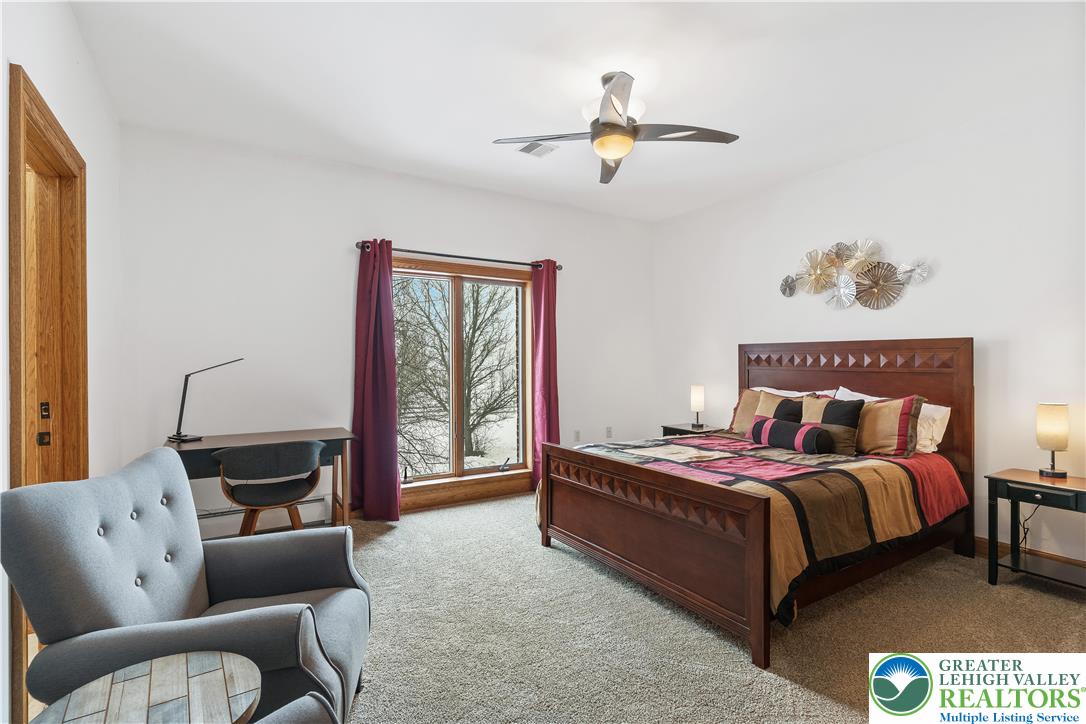 216 Merwinsburg Road Effort, PA 18330 - Photo 35 of 50 a bedroom with a bed couch and window