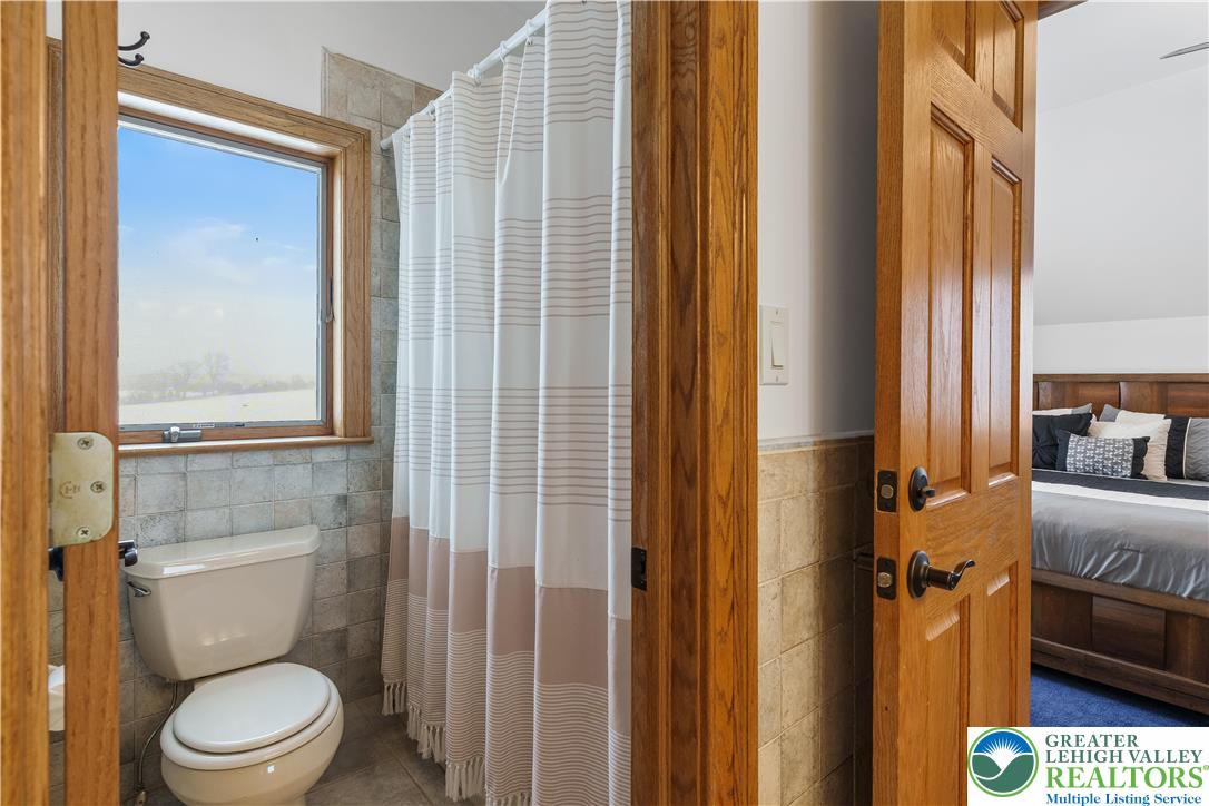 216 Merwinsburg Road Effort, PA 18330 - Photo 36 of 50 a bathroom with a toilet a sink and a window