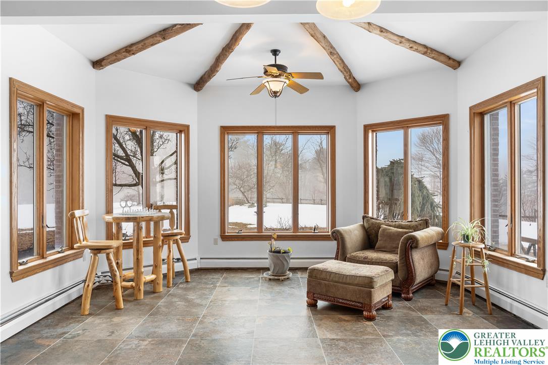 216 Merwinsburg Road Effort, PA 18330 - Photo 10 of 50 a living room with furniture and floor to ceiling windows