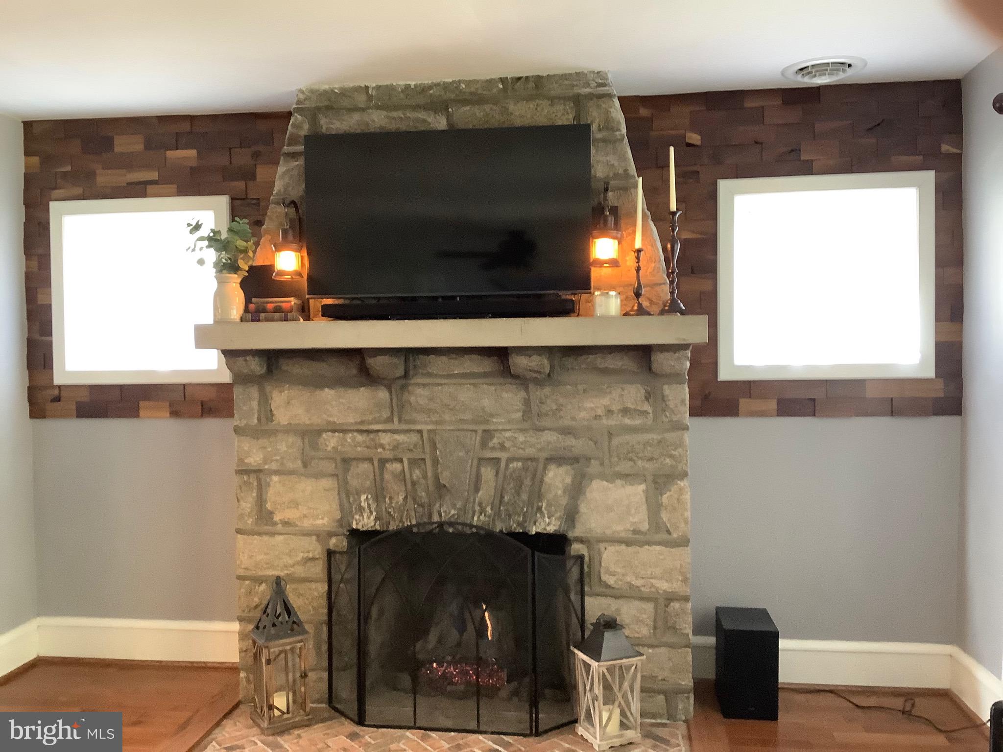 131 Rutledge Avenue Rutledge, PA 19070 - Photo 4 of 25 Gas fireplace with stone surround