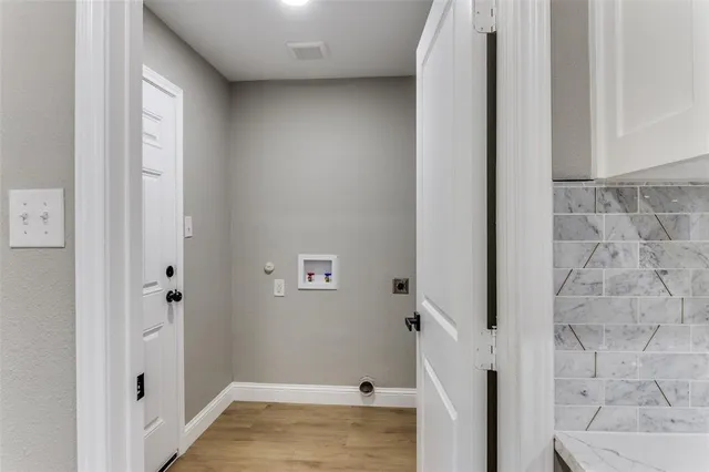 a kitchen with stainless steel appliances a refrigerator and cabinets