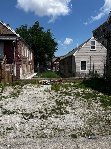 2909 West 25th Street Chicago, IL 60623 - Photo 3 of 6 a house view with a backyard space