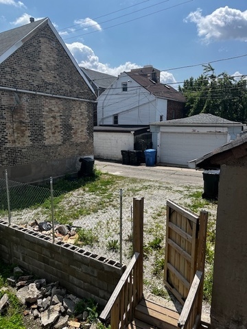 2909 West 25th Street Chicago, IL 60623 - Photo 4 of 6 a view of a house with backyard and sitting area