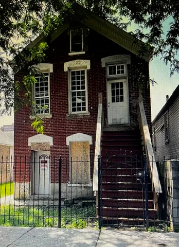a front view of a house with glass windows