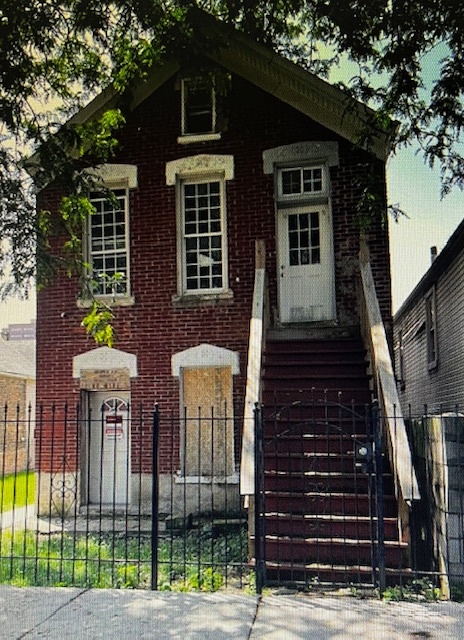 2909 West 25th Street Chicago, IL 60623 - Photo 6 of 6 a front view of a house with glass windows