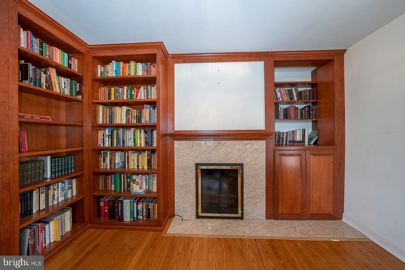 309 Church Road Devon, PA 19333 - Photo 4 of 48 Library with wood burning fireplace