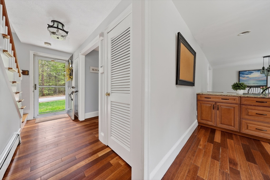59 First Parish Road Norwell, MA 02061 - Photo 18 of 37 a view of a hallway with wooden floor and a bathroom