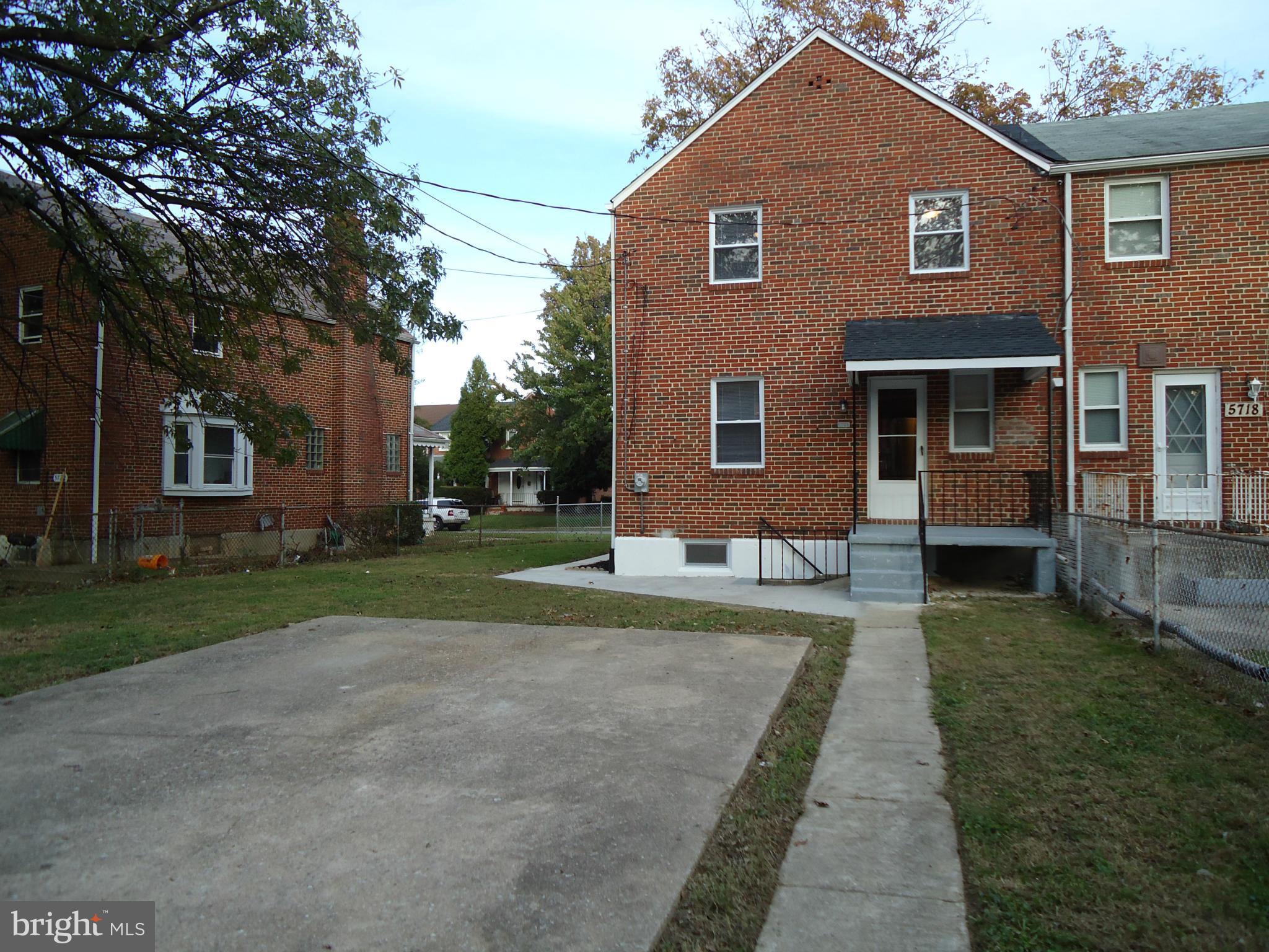 5720 Maplehill Road Baltimore, MD 21239 - Photo 11 of 25 a front view of a house with a yard