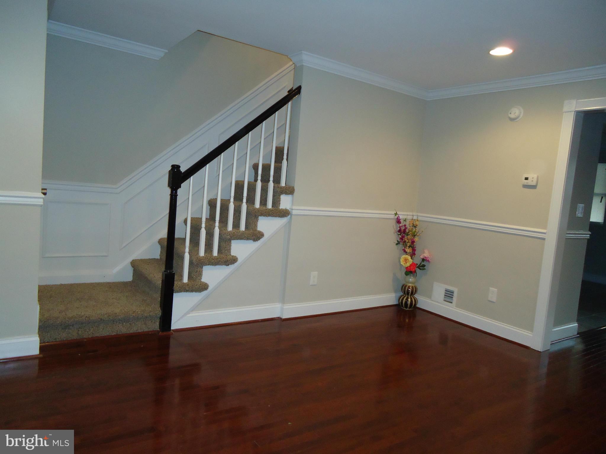 5720 Maplehill Road Baltimore, MD 21239 - Photo 20 of 25 a view of entryway with wooden floor