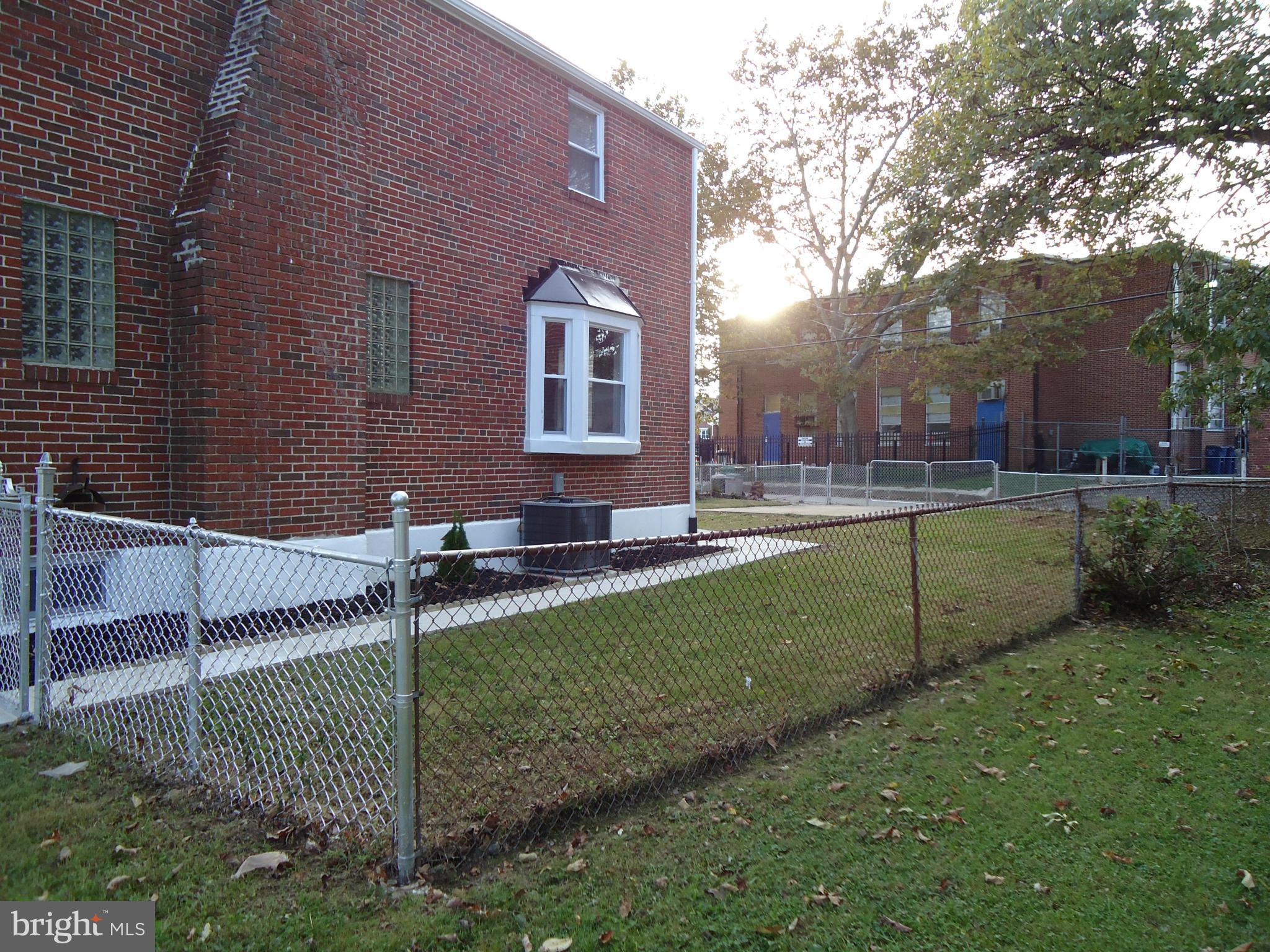 5720 Maplehill Road Baltimore, MD 21239 - Photo 3 of 25 a front view of a house with a yard