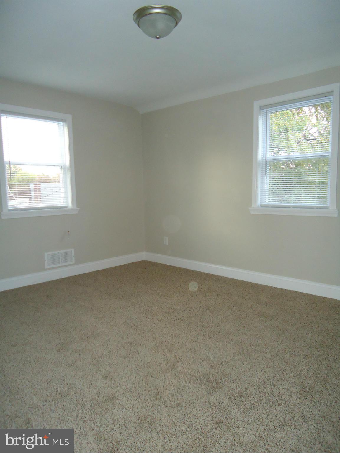 5720 Maplehill Road Baltimore, MD 21239 - Photo 24 of 25 an empty room with a window