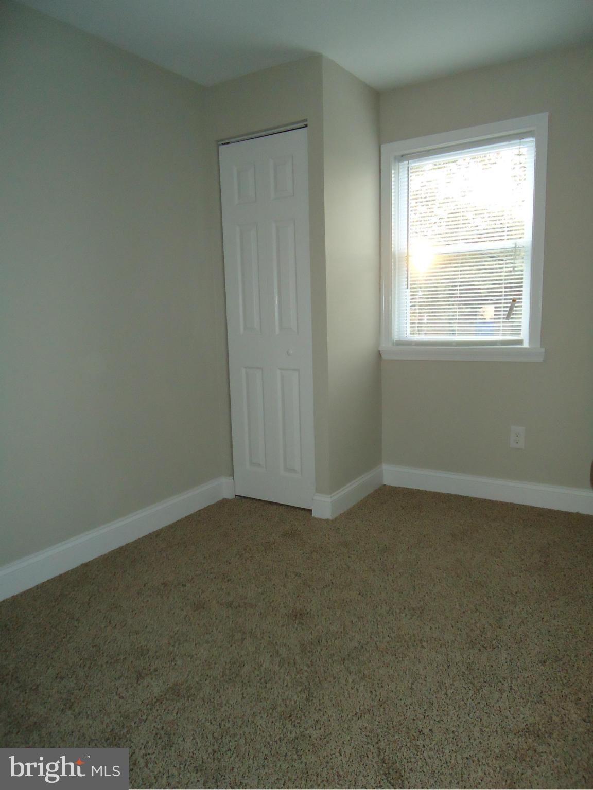 5720 Maplehill Road Baltimore, MD 21239 - Photo 25 of 25 an empty room with a window