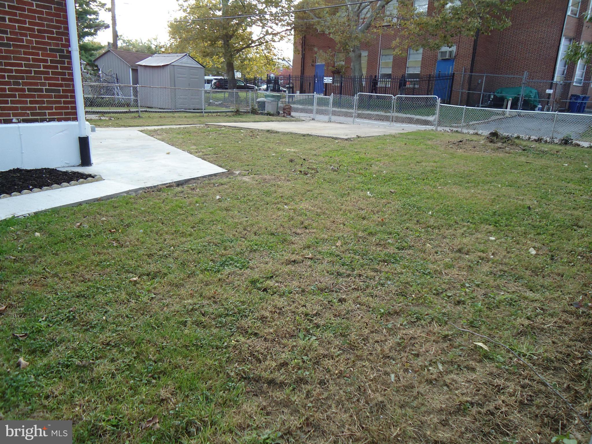 5720 Maplehill Road Baltimore, MD 21239 - Photo 4 of 25 a view of a yard with a house