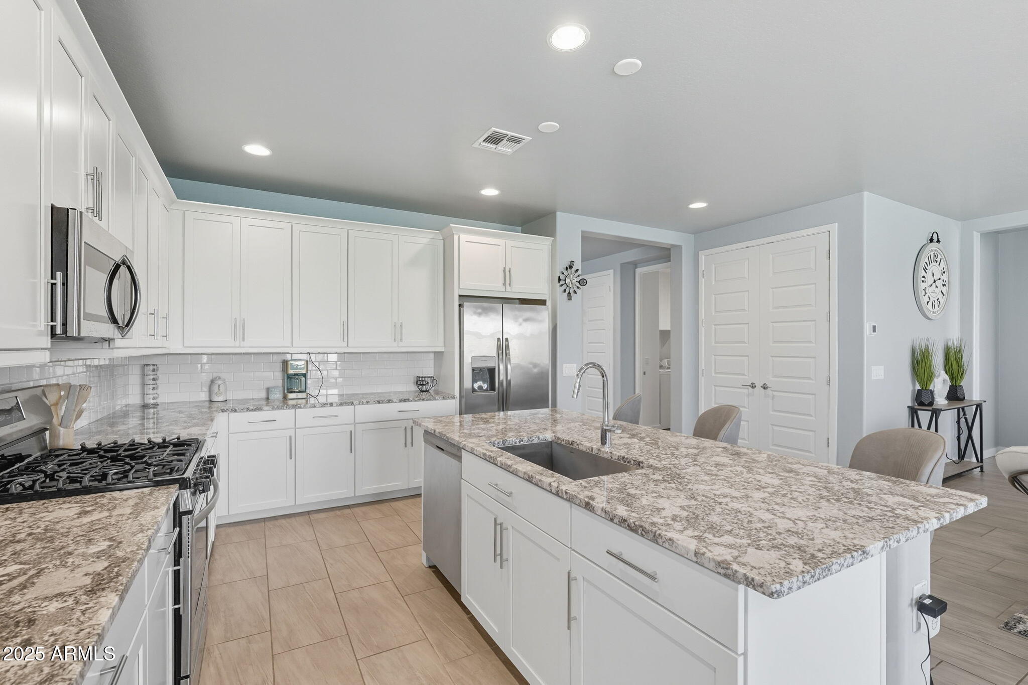 12404 East Soloman Road Gold Canyon, AZ 85118 - Photo 18 of 47 a kitchen with a sink stove and cabinets