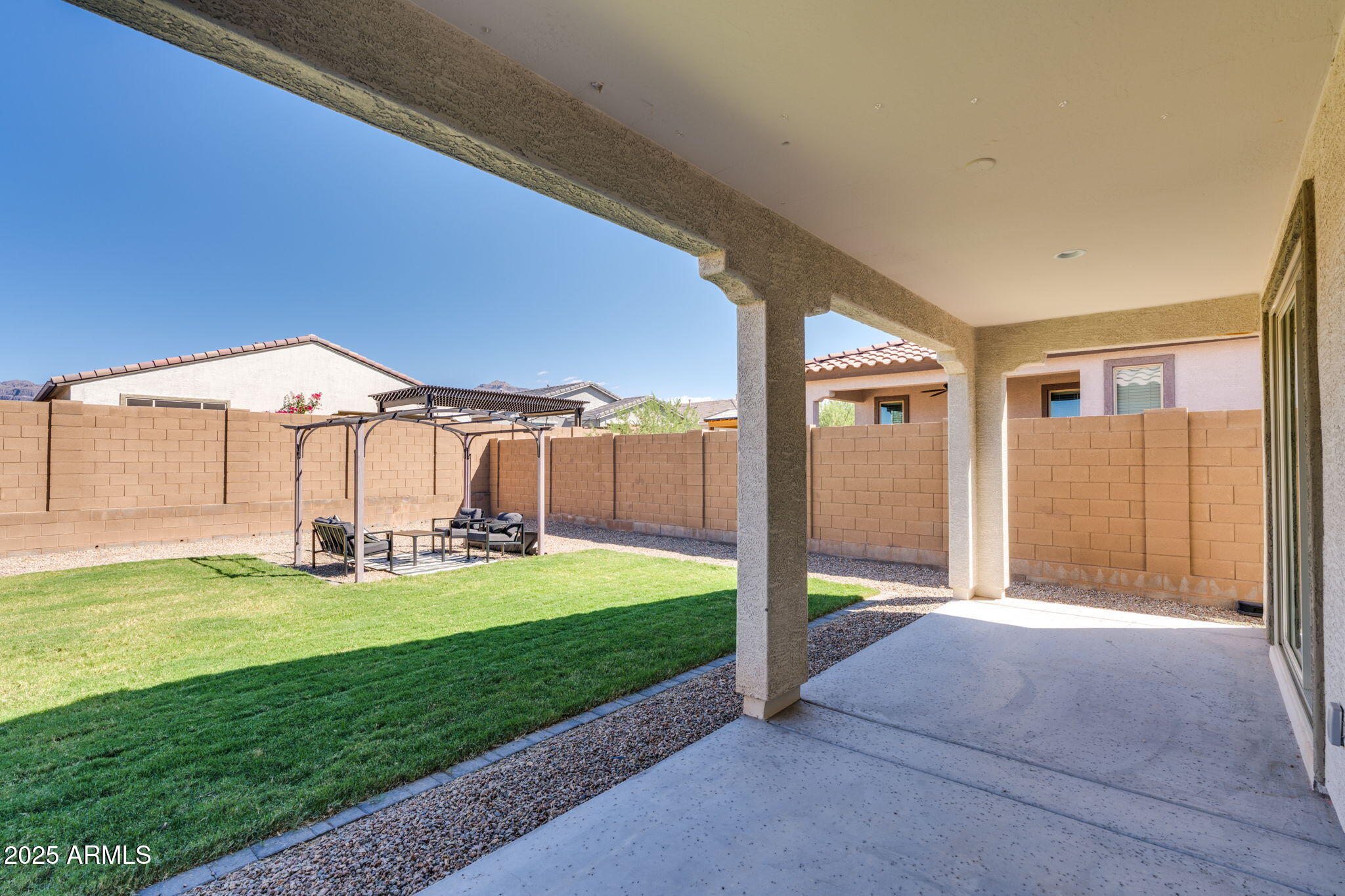 12404 East Soloman Road Gold Canyon, AZ 85118 - Photo 29 of 47 a view of a backyard with table and chairs under an umbrella