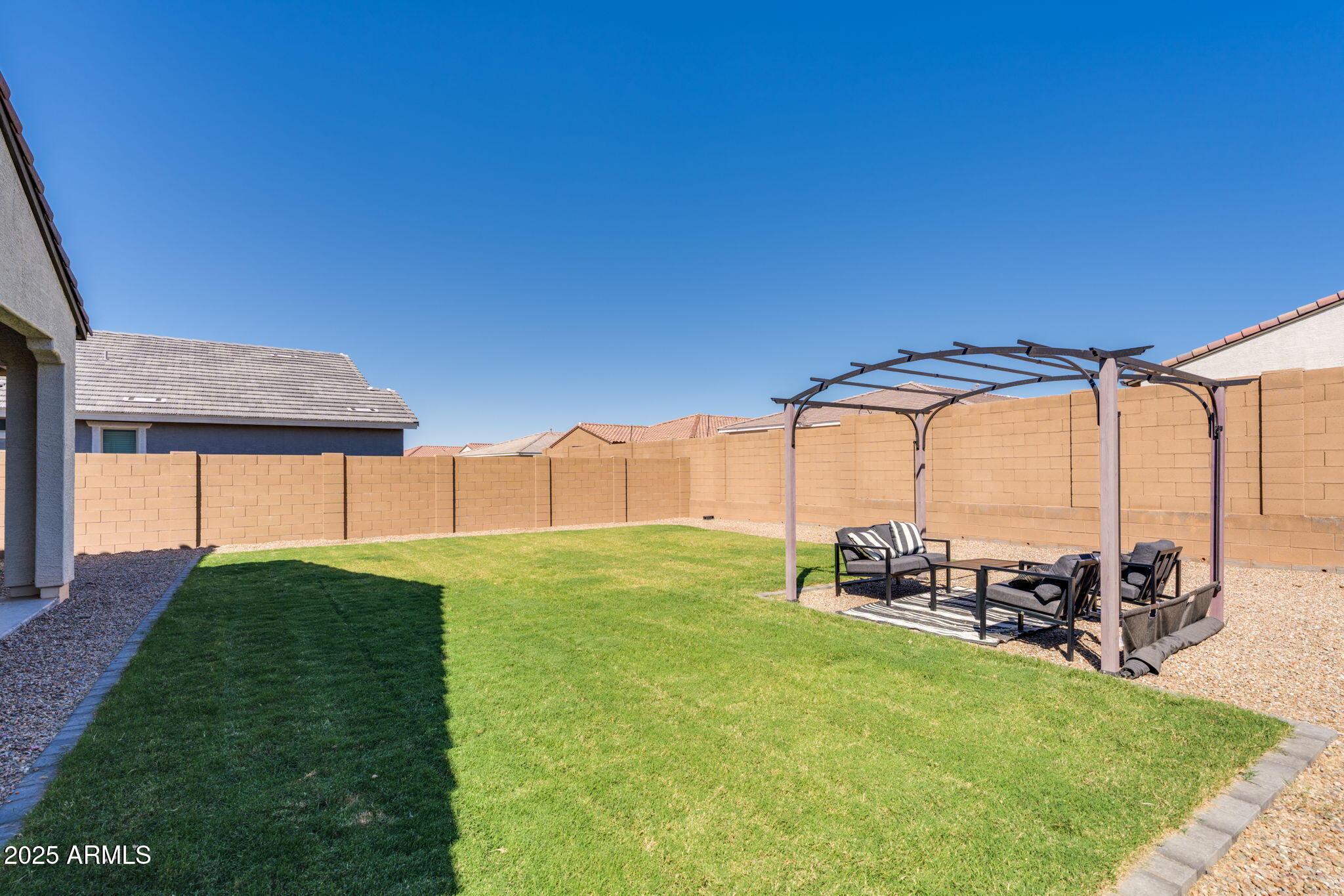12404 East Soloman Road Gold Canyon, AZ 85118 - Photo 36 of 47 a view of a backyard with a garden and outdoor seating