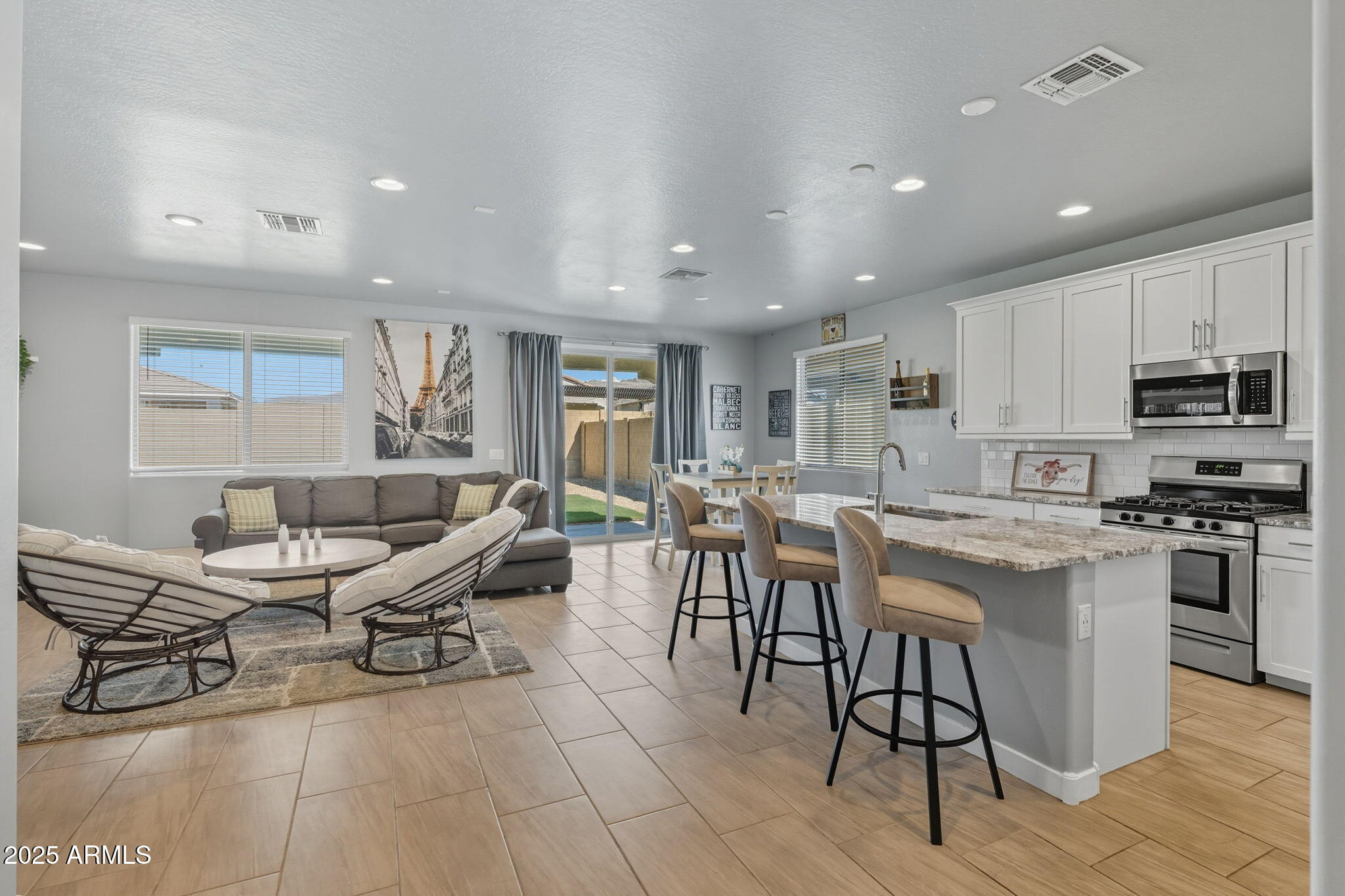 12404 East Soloman Road Gold Canyon, AZ 85118 - Photo 6 of 47 a kitchen with stainless steel appliances kitchen island granite countertop a sink and cabinets