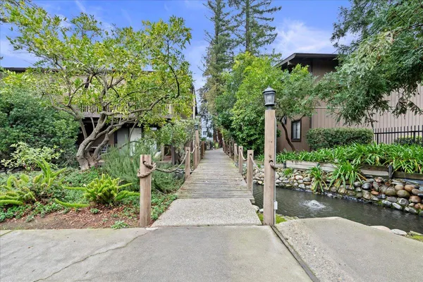 a swimming pool with outdoor seating and yard