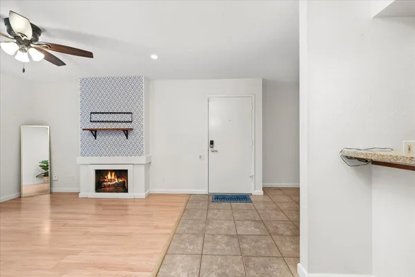 a view of an empty room with a fireplace