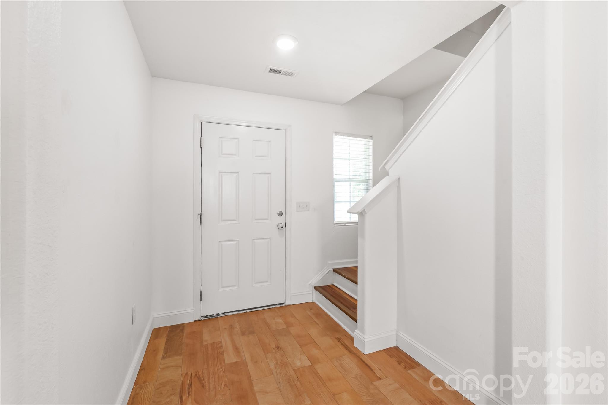 1232 Phifer Road Kings Mountain, NC 28086 - Photo 7 of 36 a view of a room with wooden floor and white walls