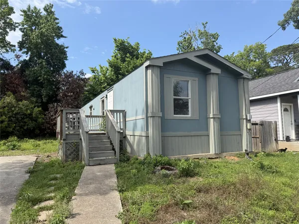 a house with trees in the background